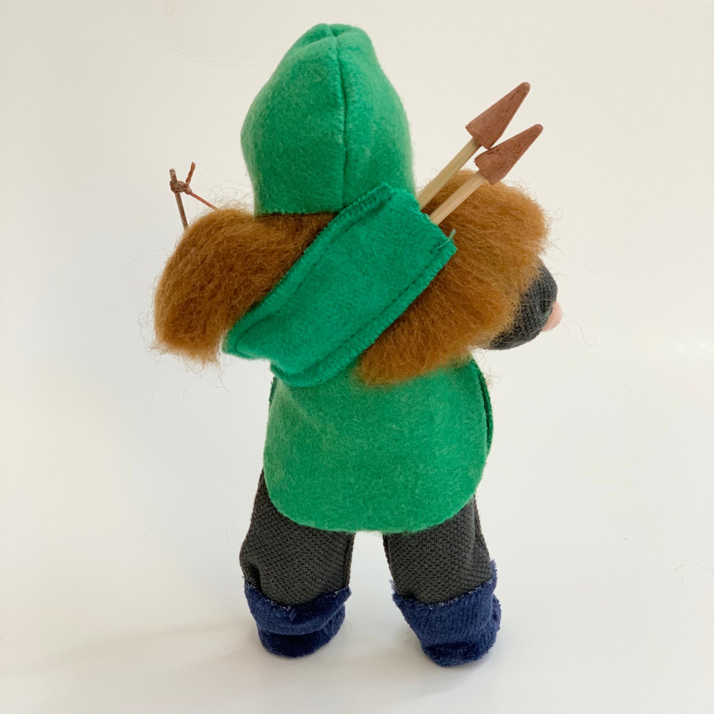 back of evi green knight doll with red hair and bow and arrows