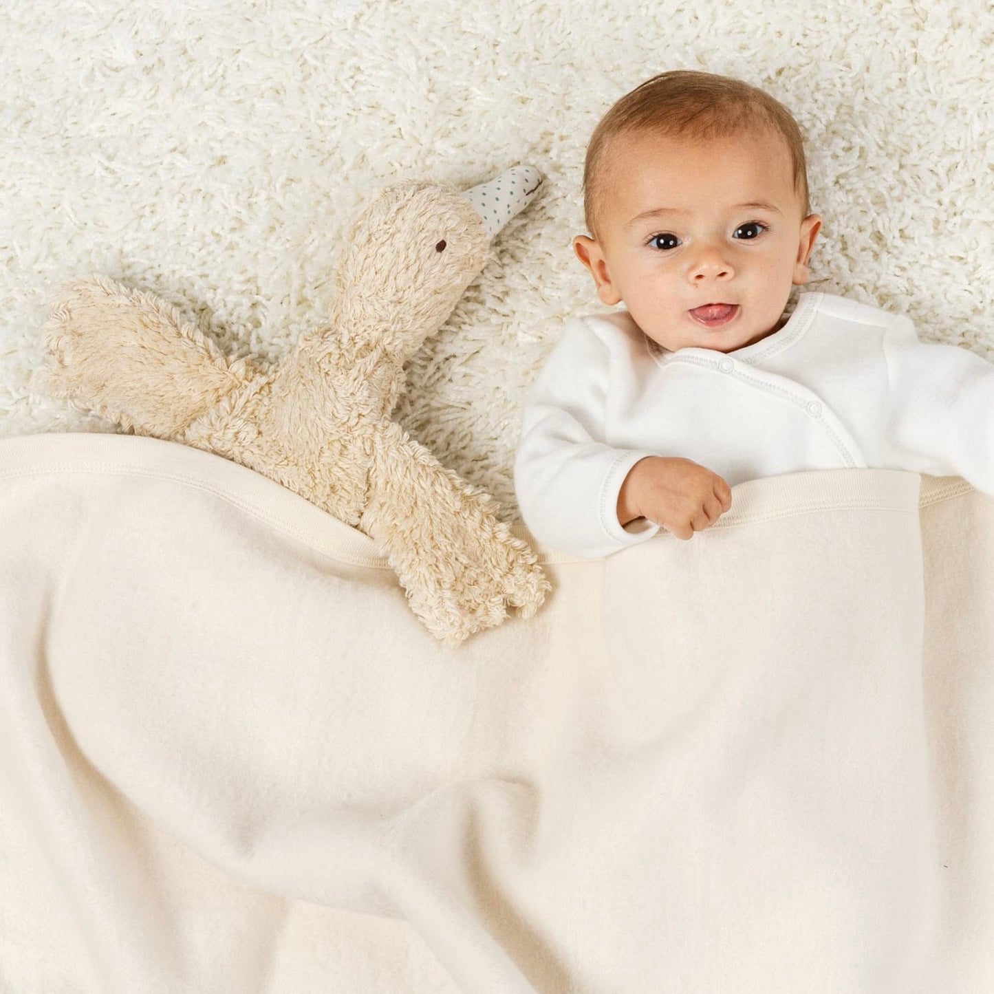 Baby with organic goose toy