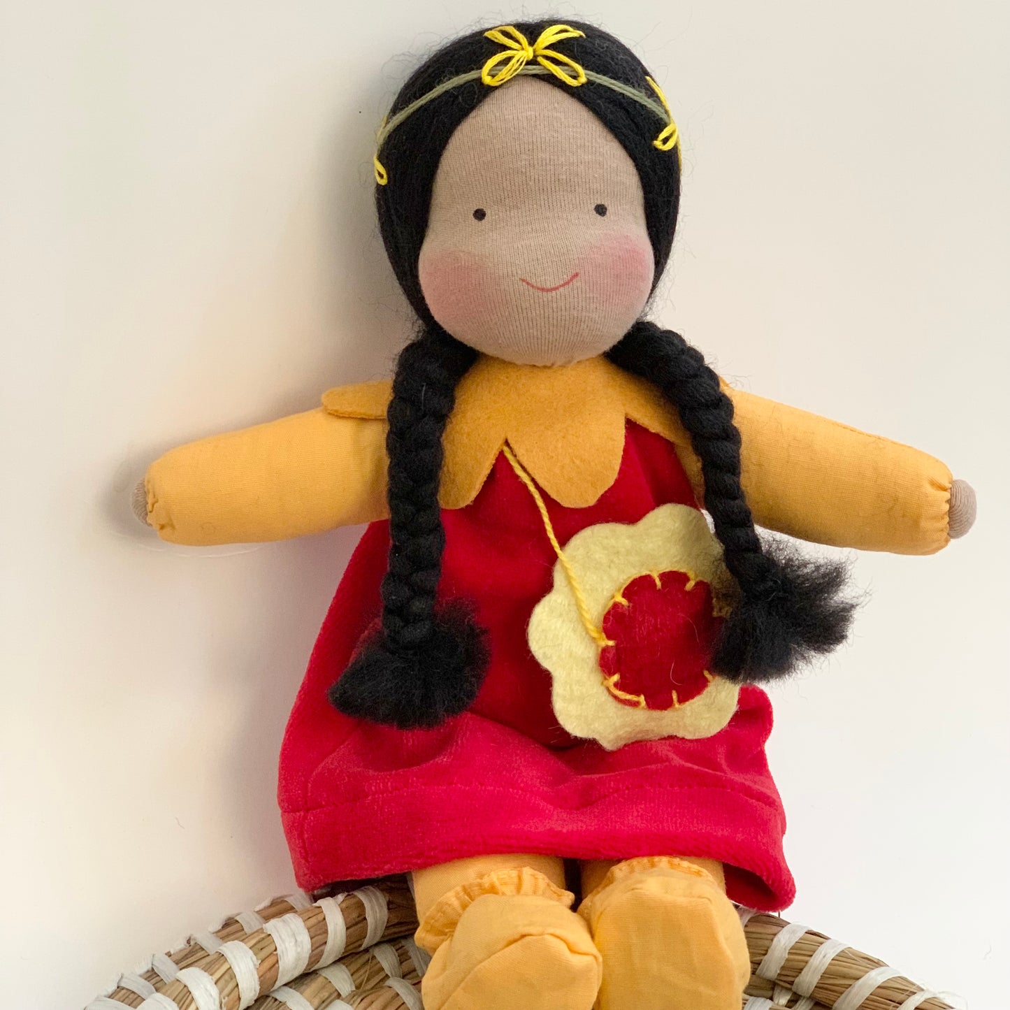 evi waldorf aromatic scarlet flower doll with brown skin and black hair