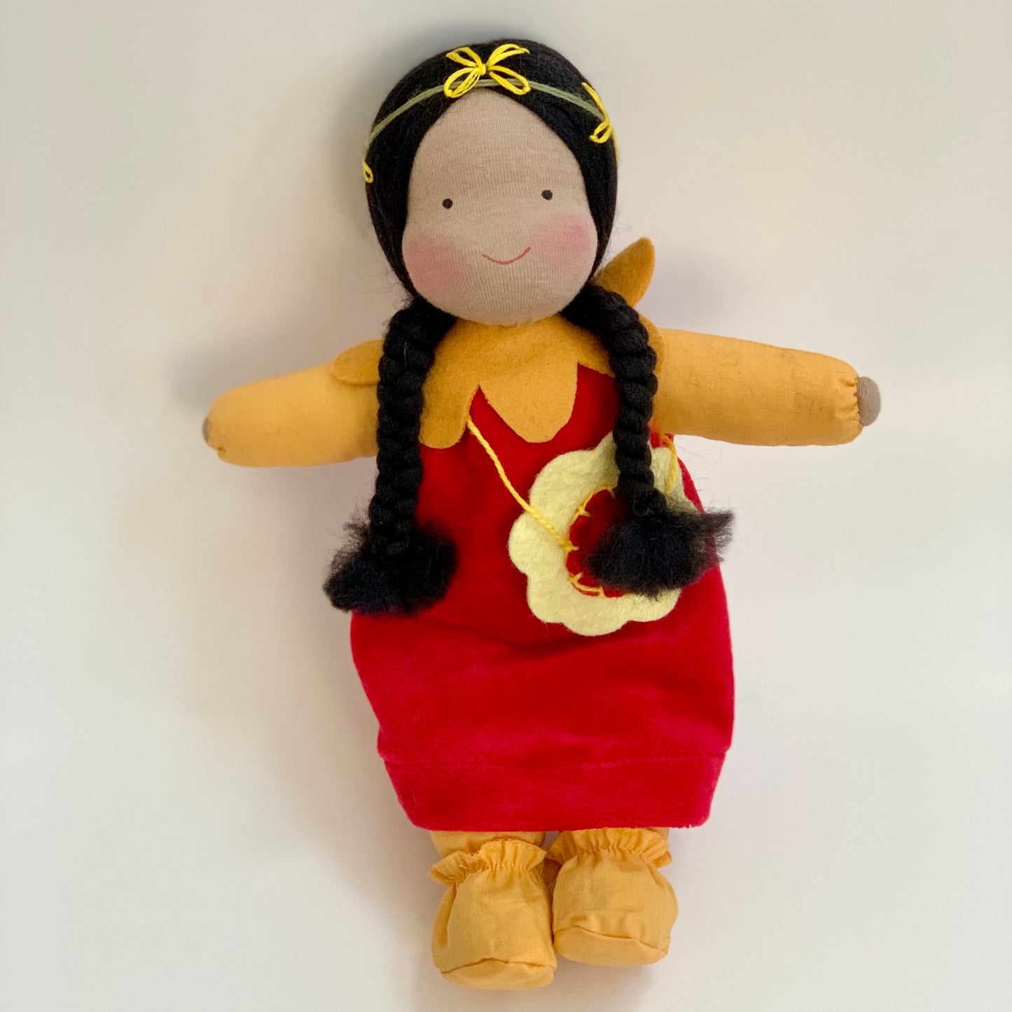 evi handmade waldorf doll scarlet flower with brown skin and black hair