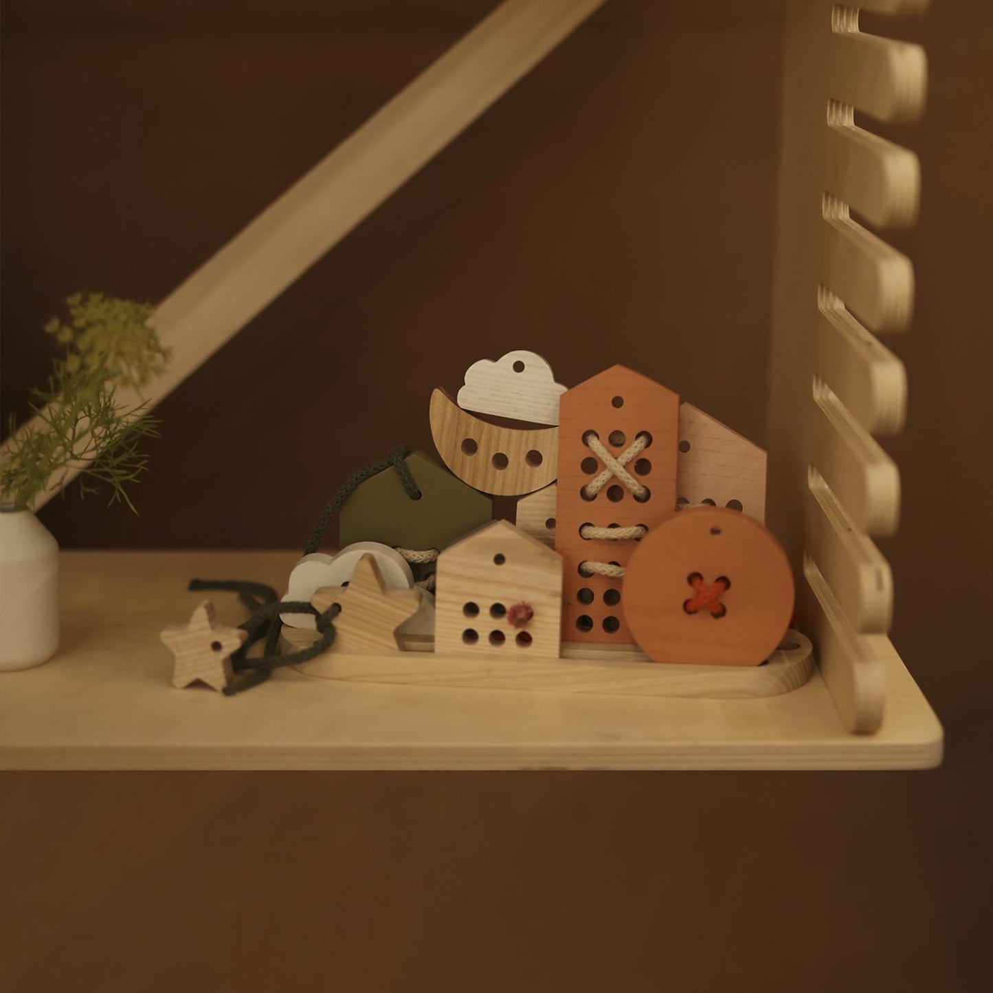 display of wooden houses and sky lacing toys