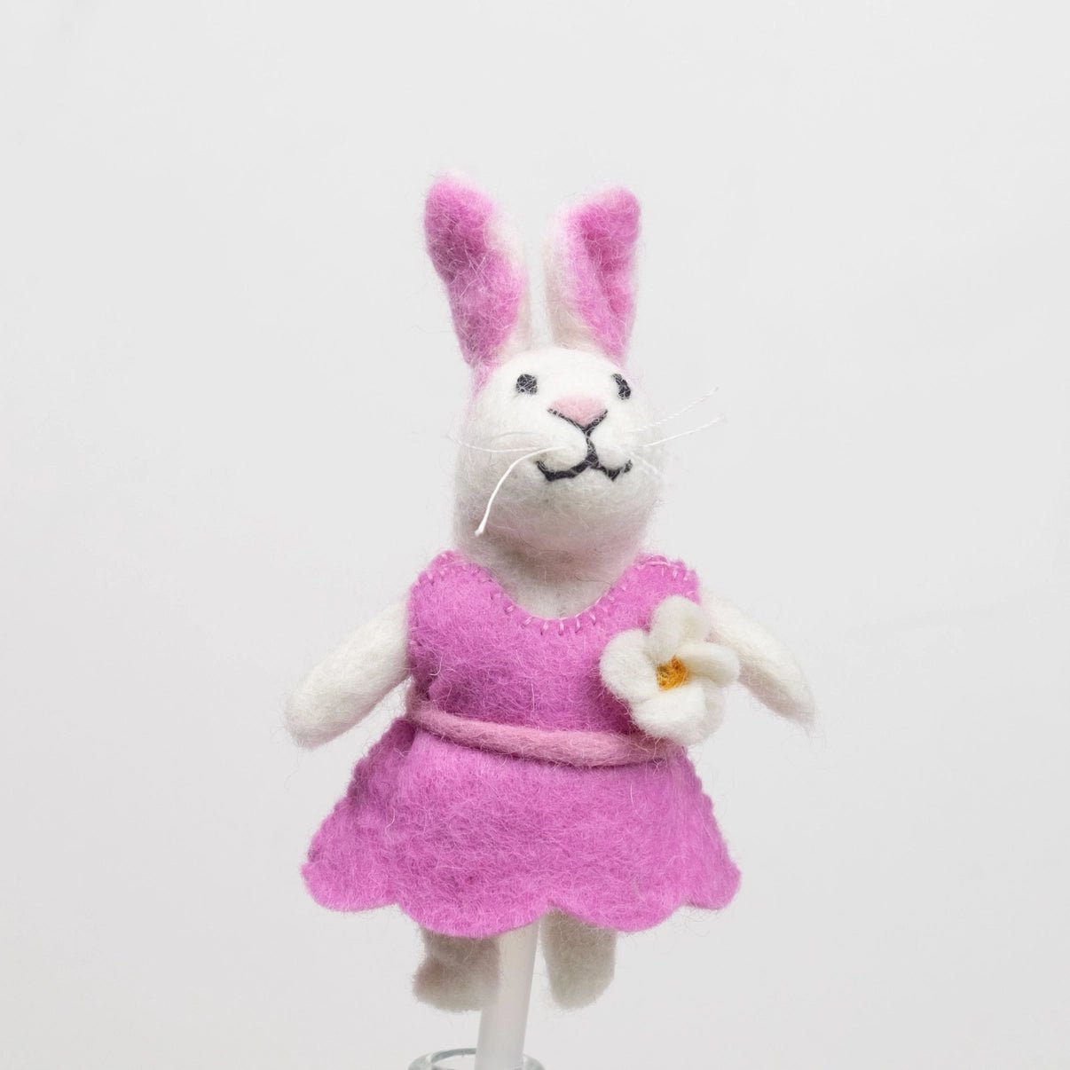 hand felted girl bunny rabbit finger puppets in a pink dress with a white daisy