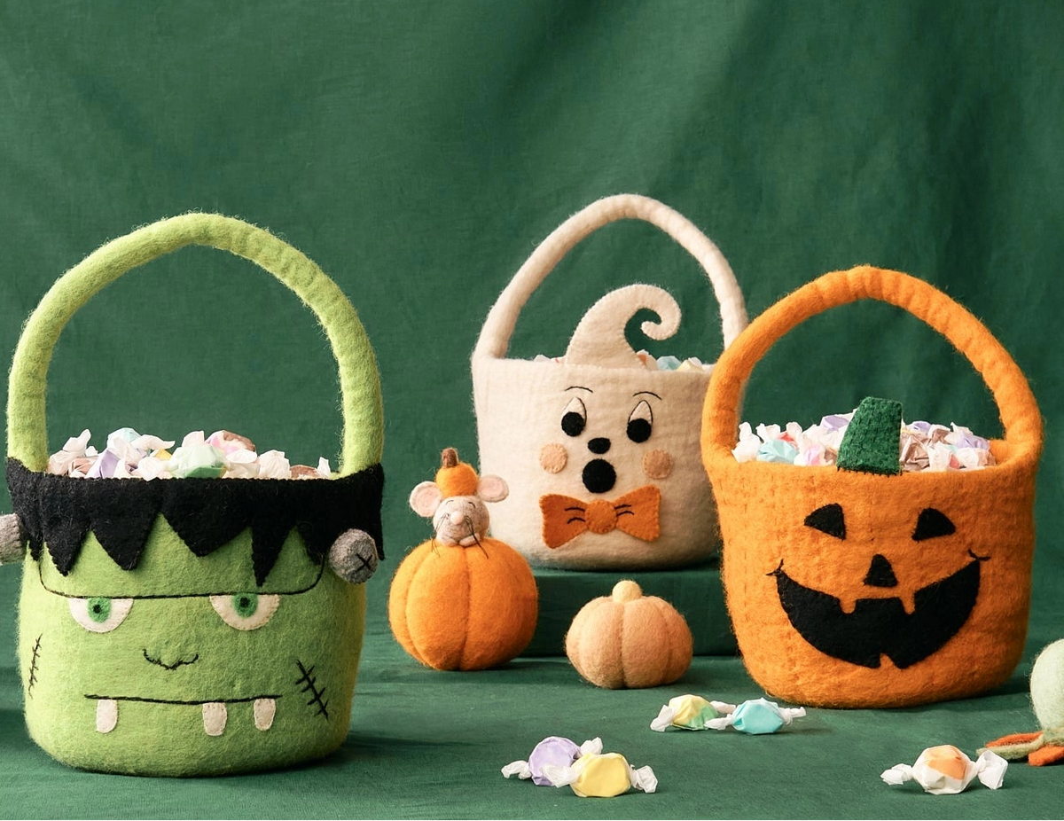 Four Halloween-themed felt candy baskets including Frankenstein, a Jack-o-lantern, and a ghost.