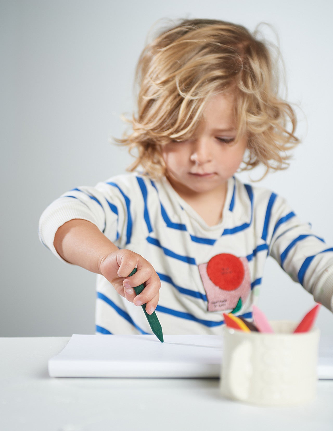 boy coloring with eco kids beeswax crayons