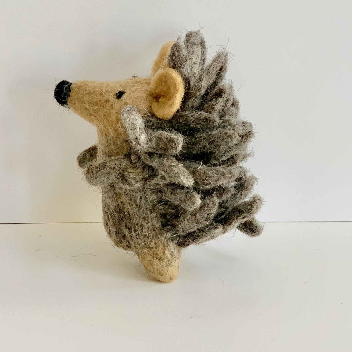 winding road fair trade hedgehog finger puppet toy