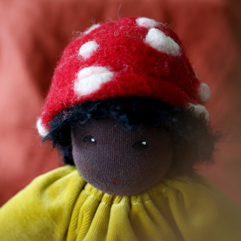 nanchen black Waldorf doll hand painted face and red mushroom cap