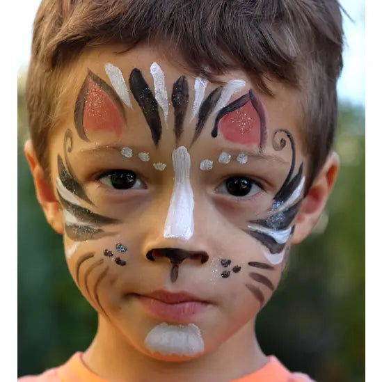 Boy with tiger face paint using Natural Earth face paint kit