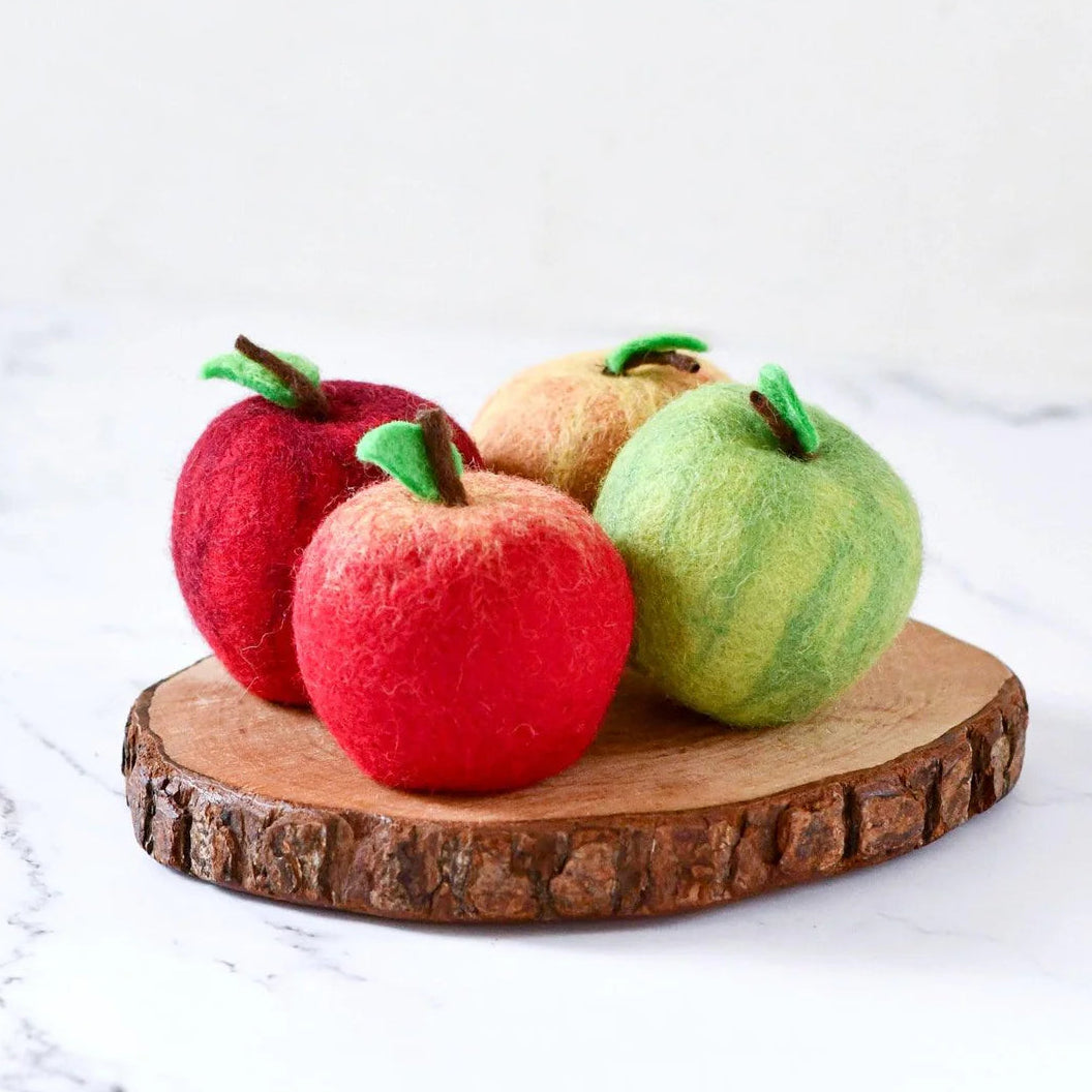 Tara Treasures Four felted apple toys on a wooden stand
