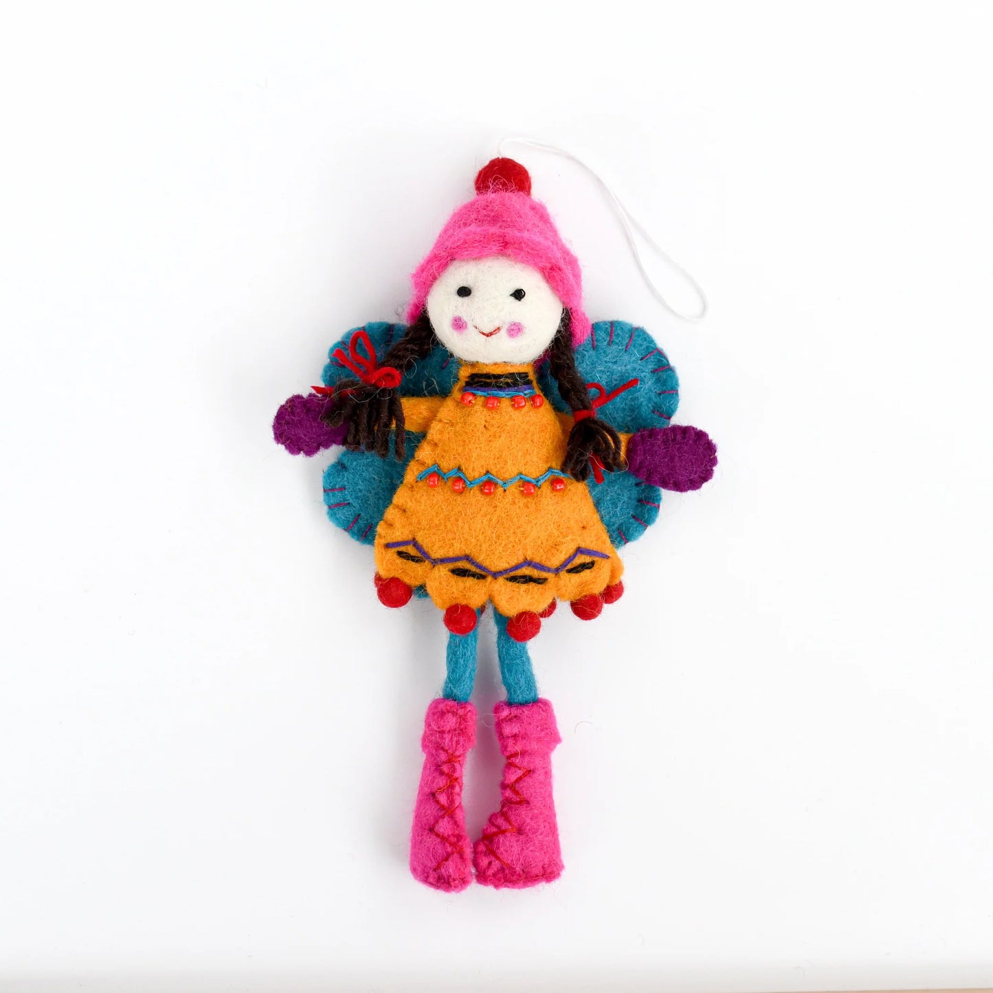 Colorful felted fairy doll with a pink hat and orange dress and blue wings