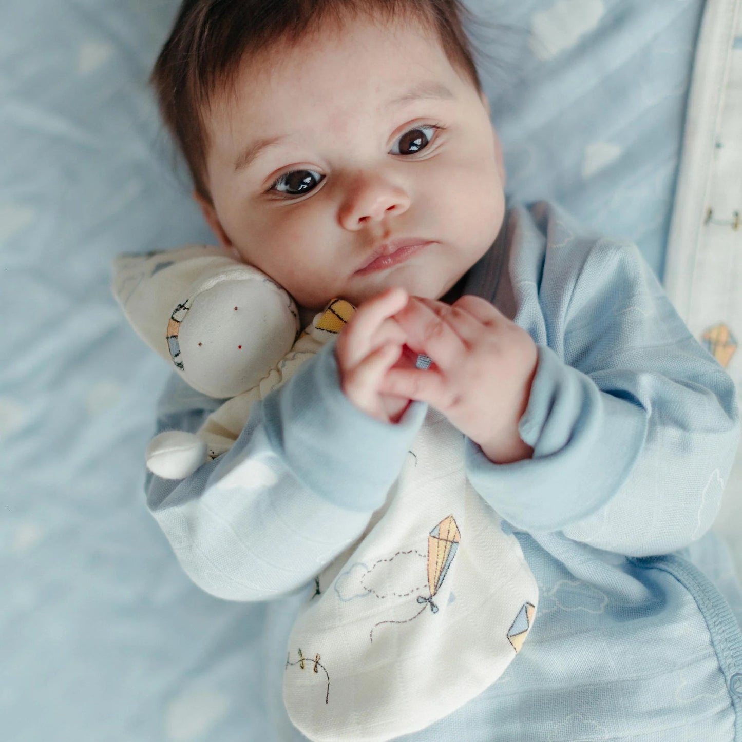 baby with under the nile organic kites sleeping lovey doll