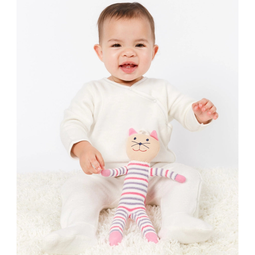 Baby holding Under the Nile scrappy cat with pink stripes