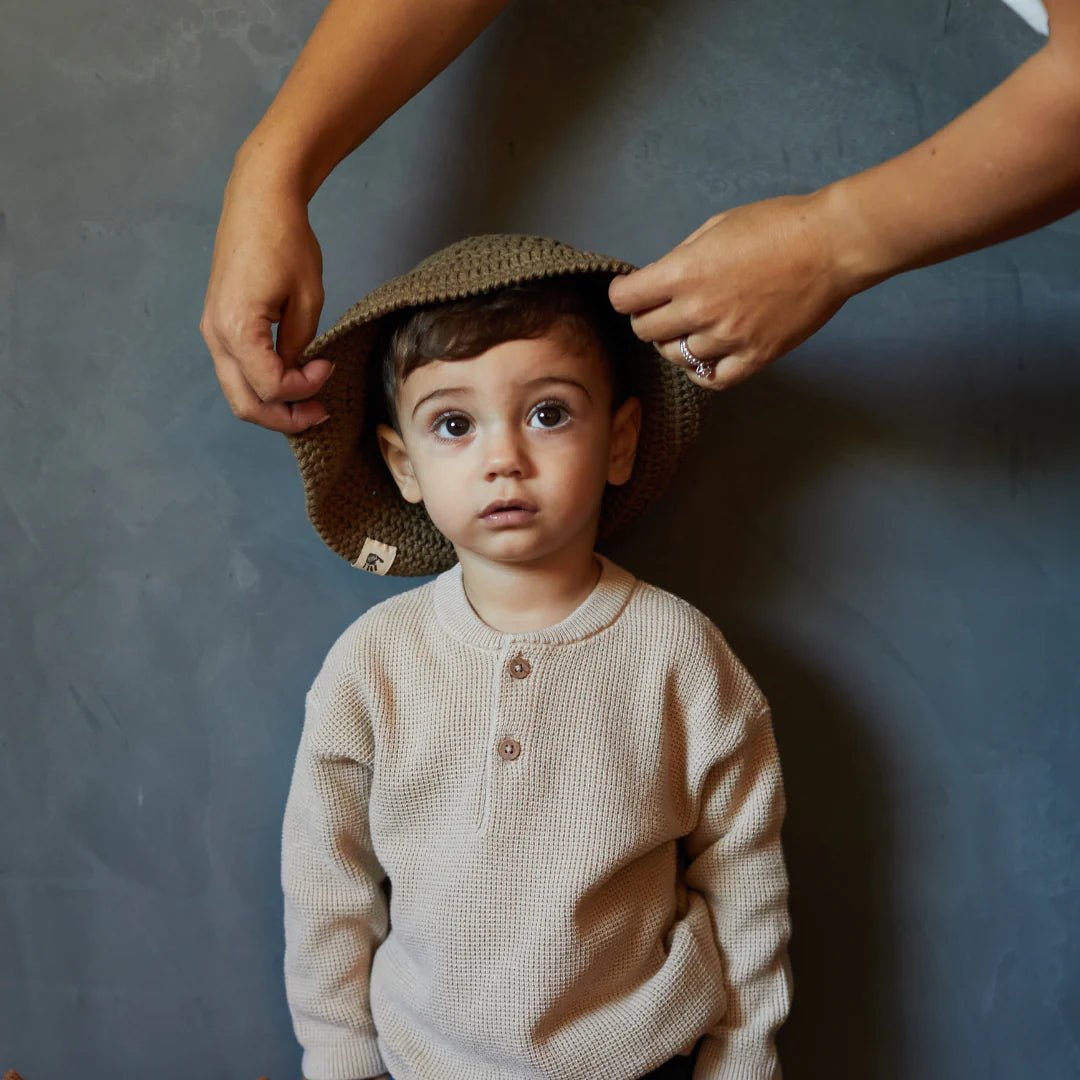 Boy wearing handmade hat