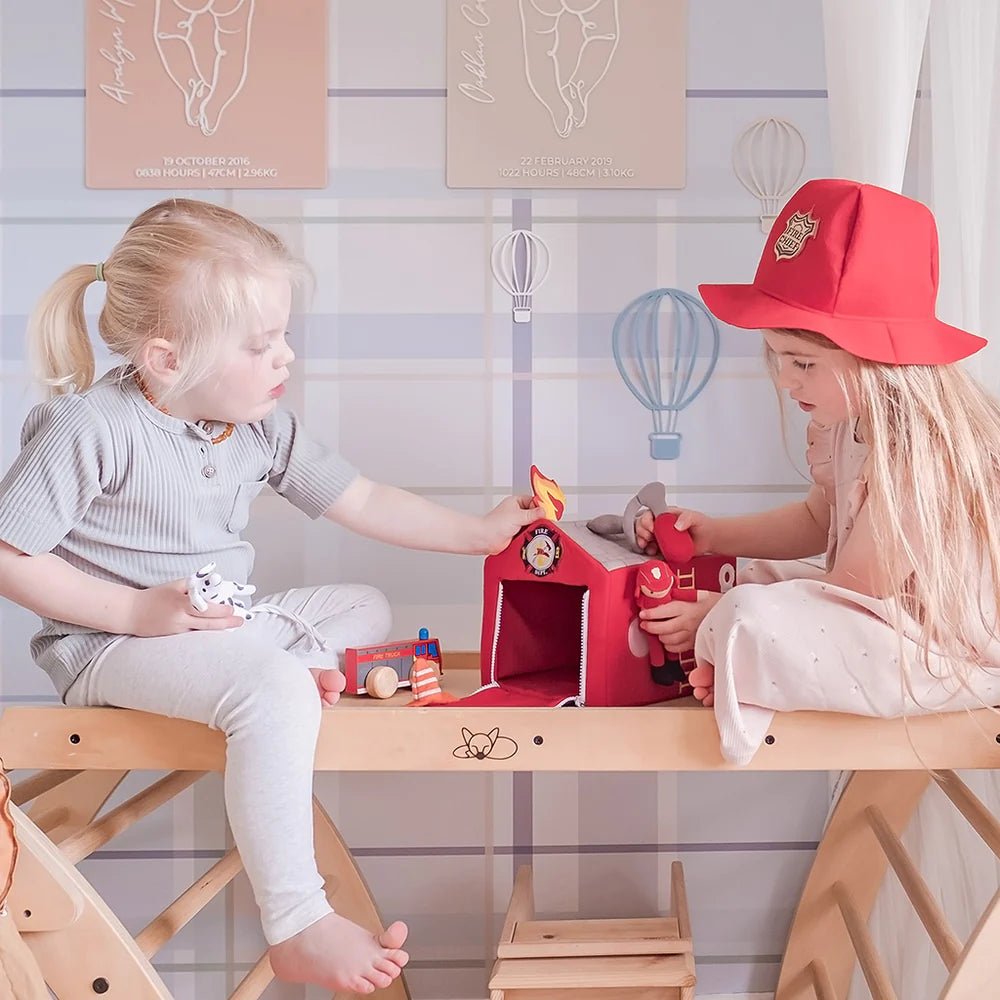 Kids playing with fire station toy