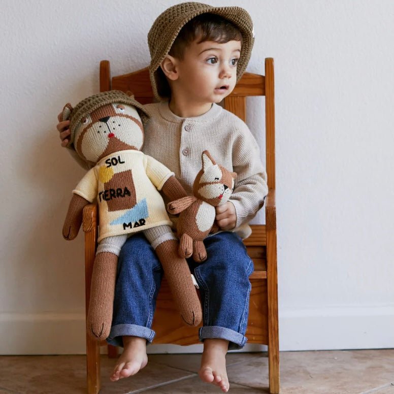 Boy and French bulldog stuffed animal