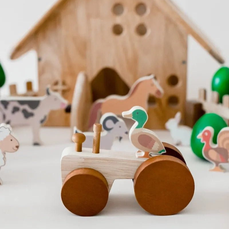 wooden duck on a tractor toy and farm playset