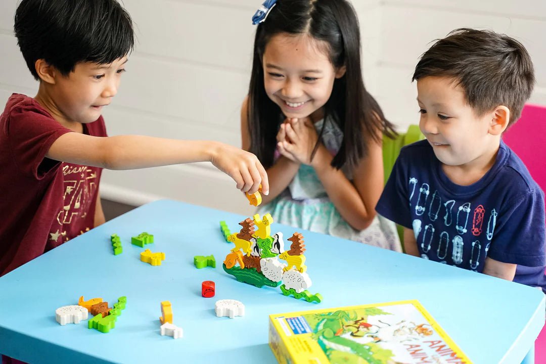 kids playing wooden animal stacking game