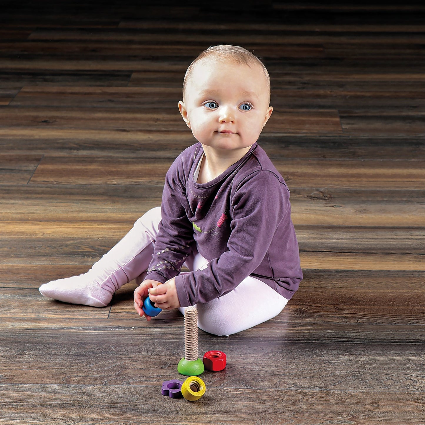 erzi toddler playing with wooden screw turning toy