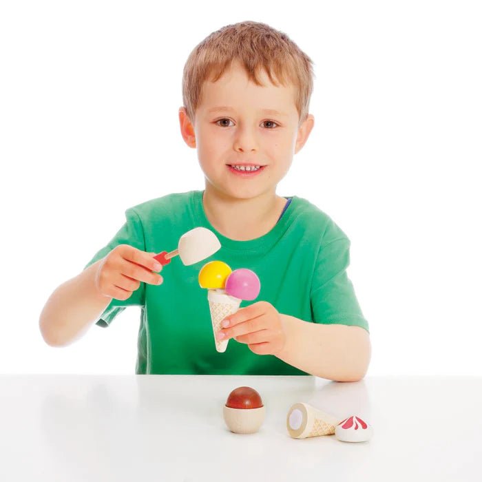 boy playing with erzi wooden ice cream play food set