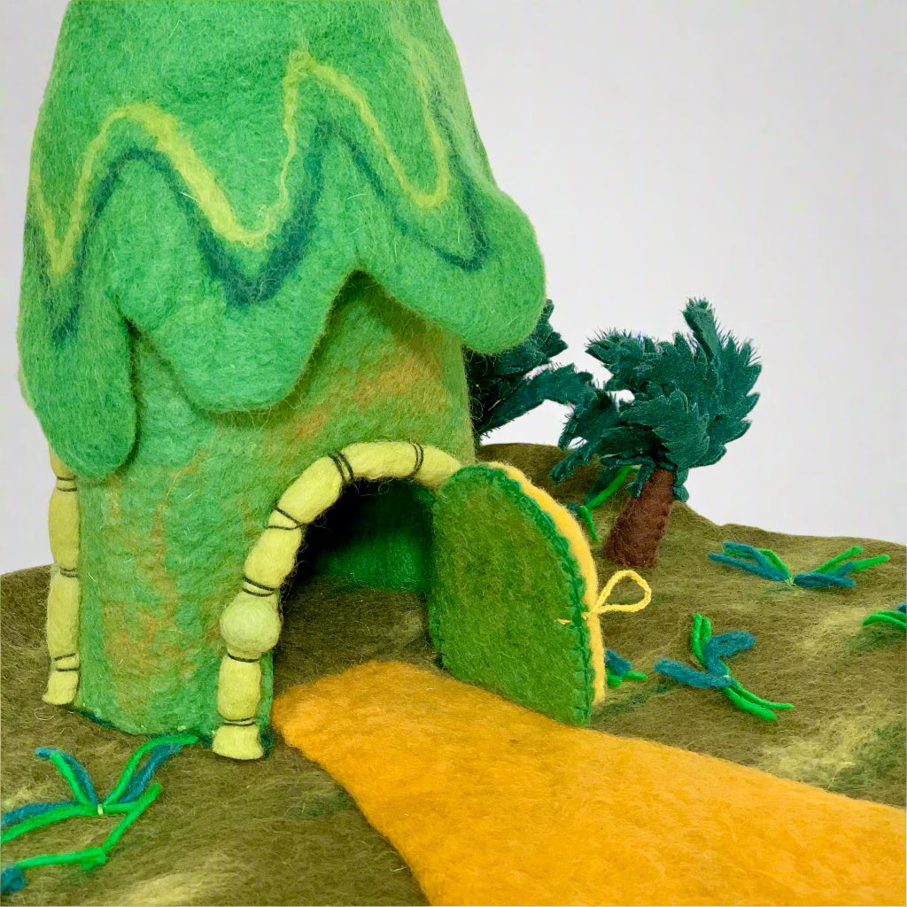 winding road felt jungle hut dollhouse toy with trees and open door