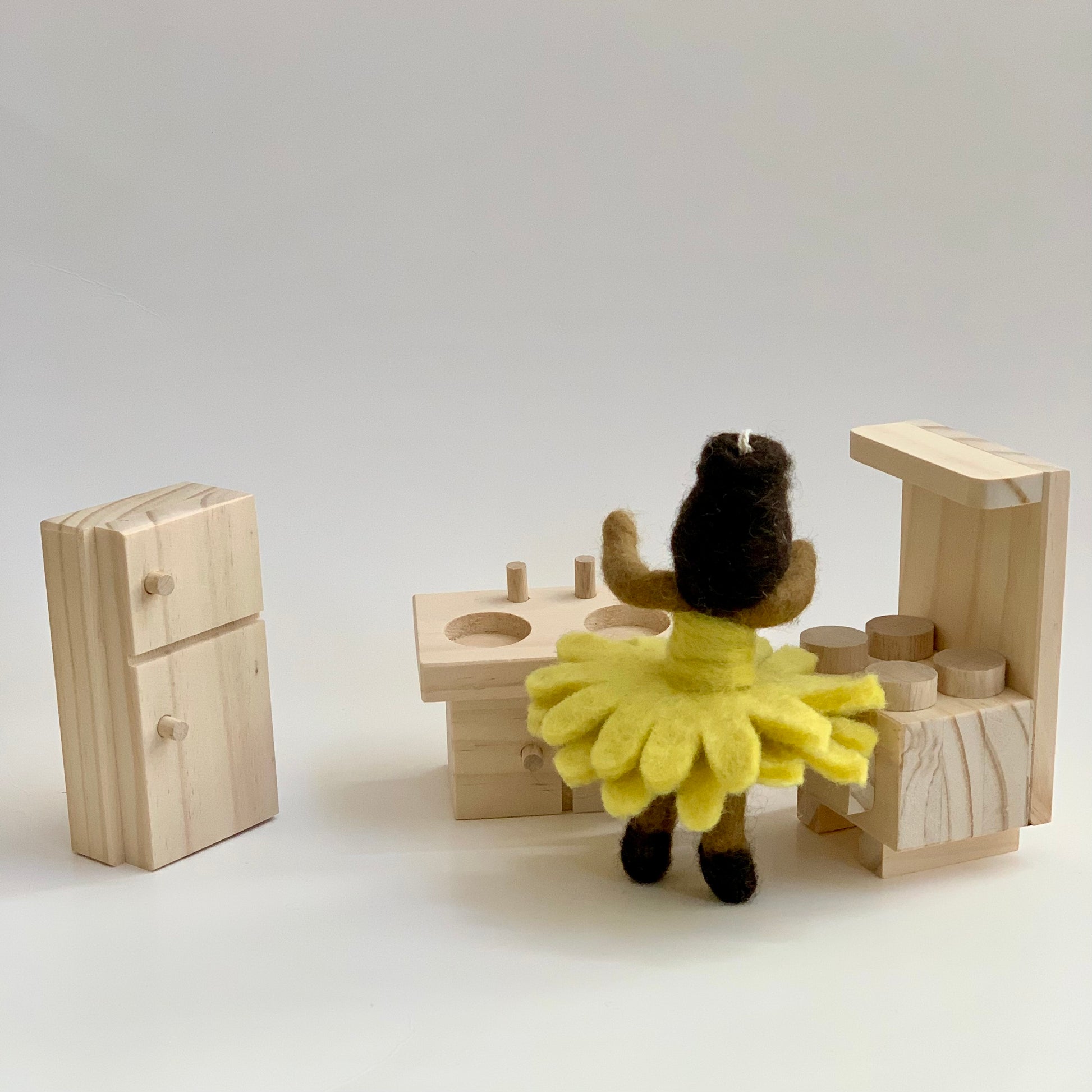 doll with qtoys natural wooden dollhouse refrigerator, stove, and sink toys