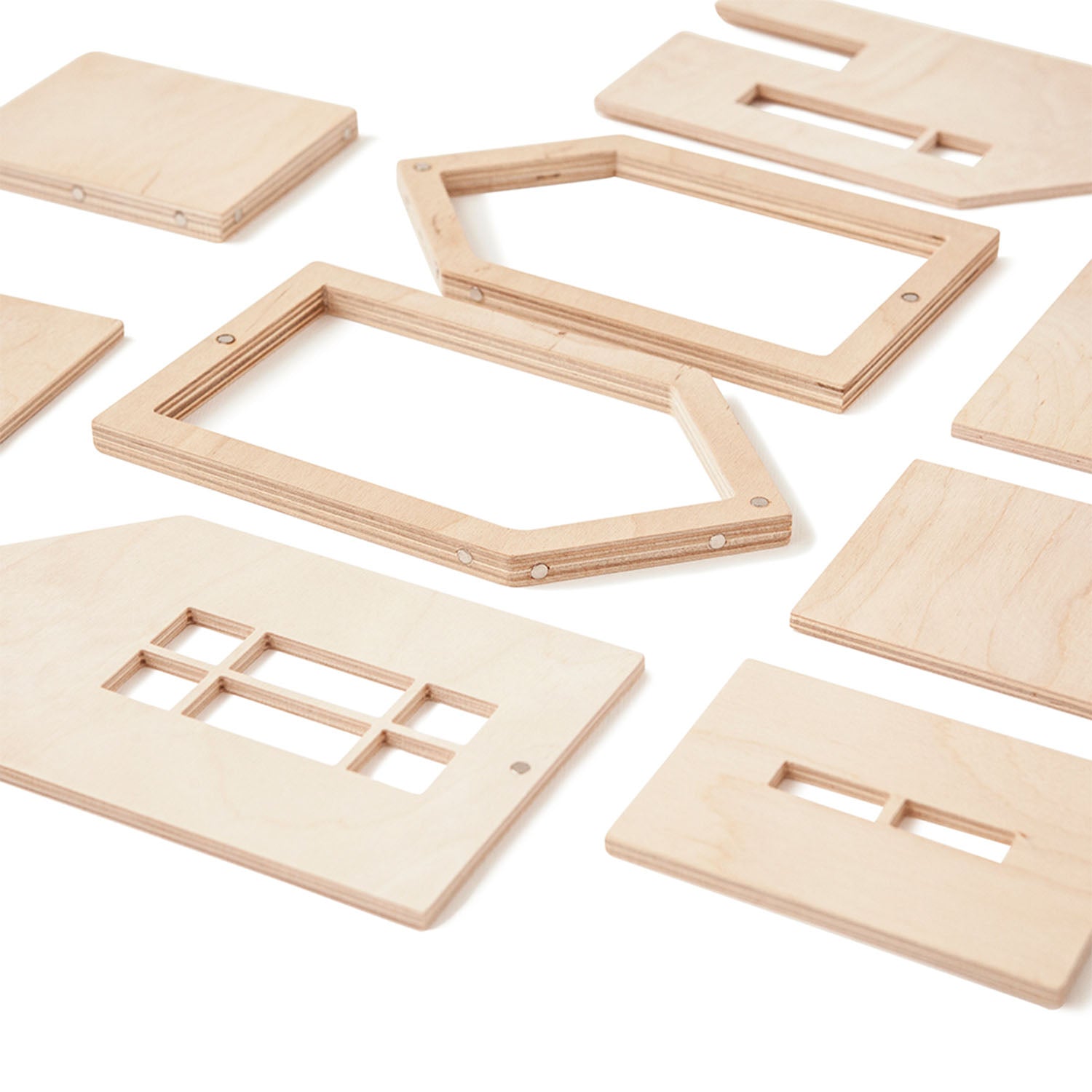 wooden dollhouse pieces laid flat