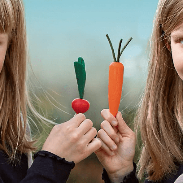 Girls with erzi wooden play food carrot and radish