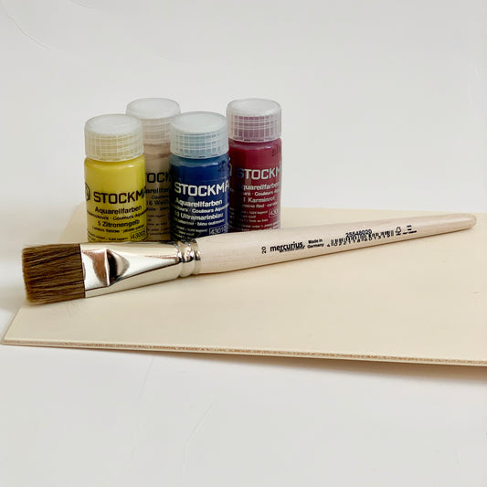 Set of Stockmar paint bottles and a flat tip vegan paintbrush for young children.  