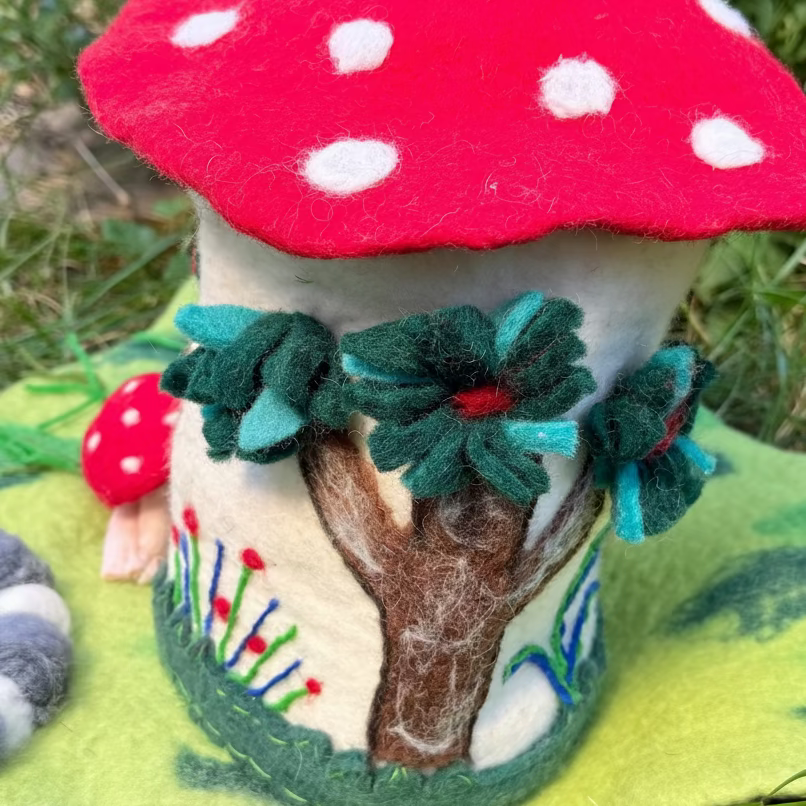 Felted mushroom fairy dollhouse with a forest setting playmat