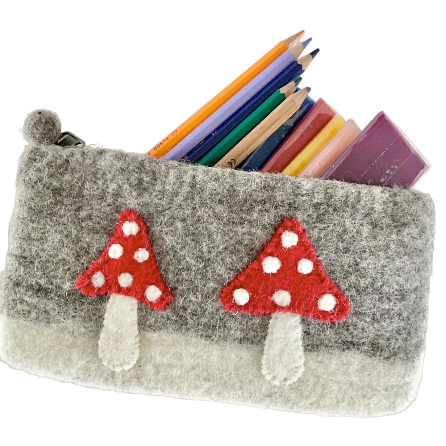 Felted gray pouch with red mushrooms holding colored pencils and modeling beeswax sheets.