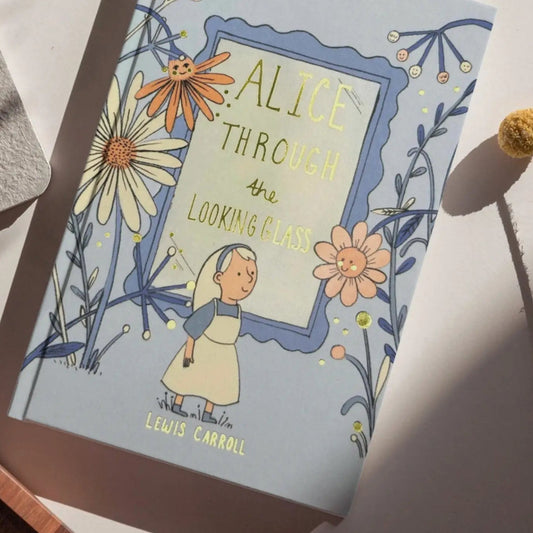 Wordsworth Classic Collector's Edition 'Alice Through the Looking Glass' clothbound hardcover book by Lewis Carroll with floral illustrations.
