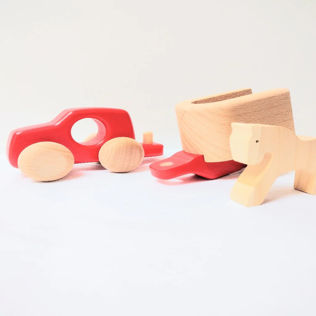 Bajo wooden trailer detached from a red toy car with a natural horse