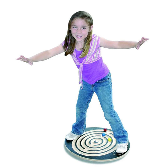 girl standing on a labyrinth balance board 