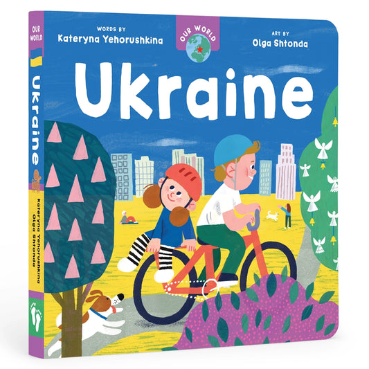 Our World Ukraine children's board book with a boy and girl on a bike on the cover
