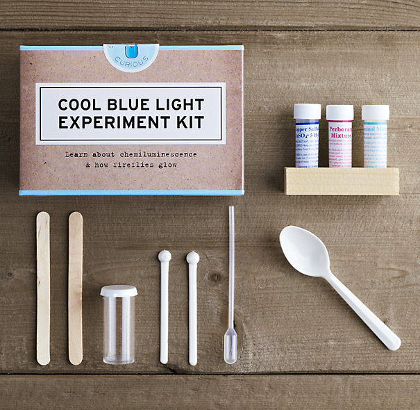 Cool Blue Light Science Experiment Kit with various chemistry components.