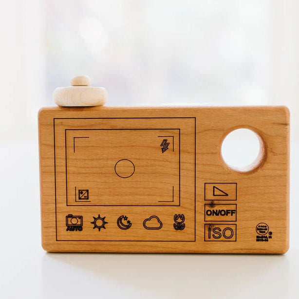 lasered screen on back of natural wooden toy camera