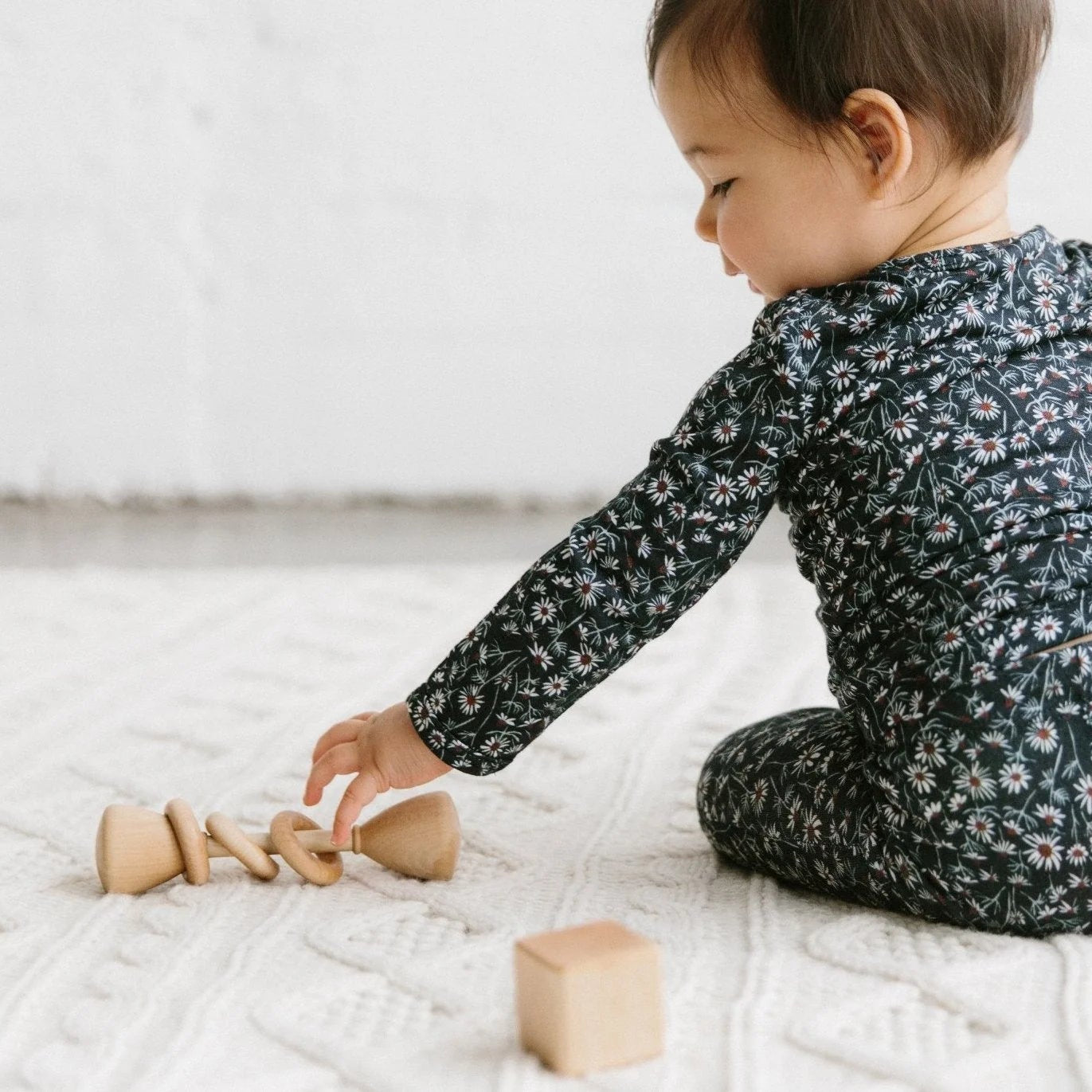 baby playing with bannor toys classic wooden organic toy rattle