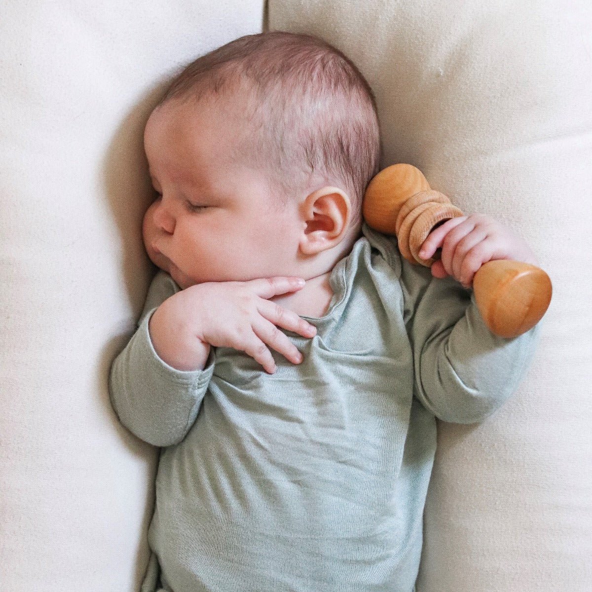 baby holding bannor toys classic natural organic rattle