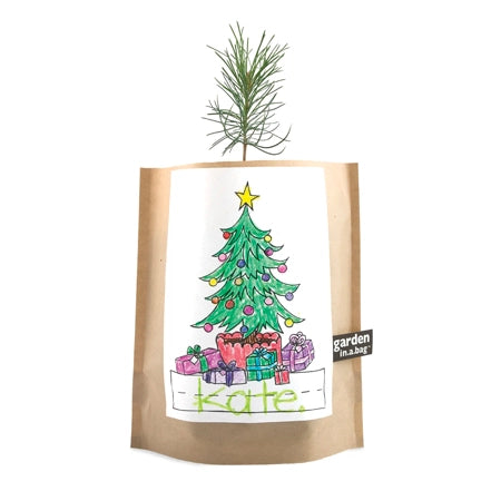 Christmas tree in a grow bag with a  hand-drawn Christmas tree and presents. A small black tag on the right reads: garden in a bag.