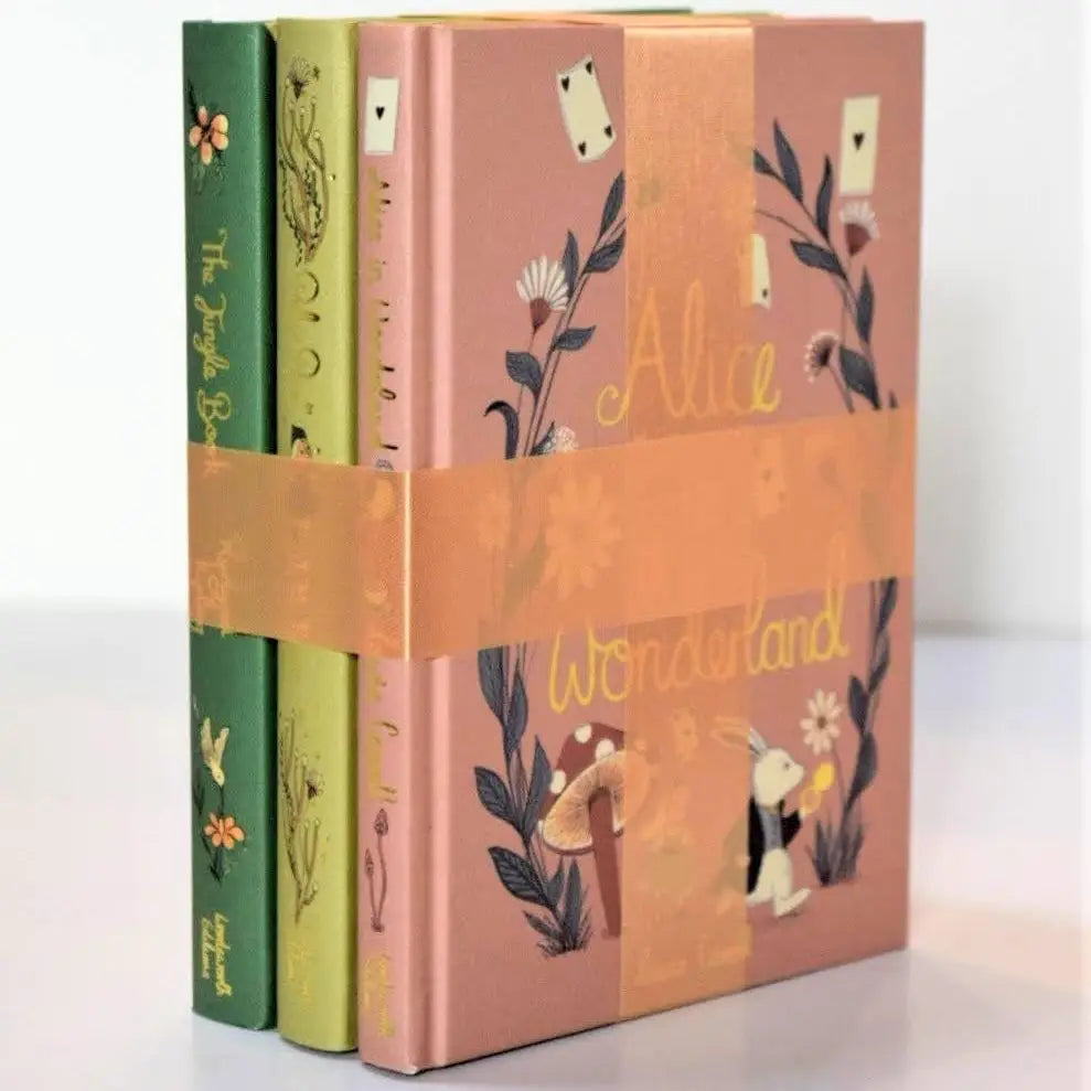 Set of three hardcover collector's edition children's classic books with decorative covers 