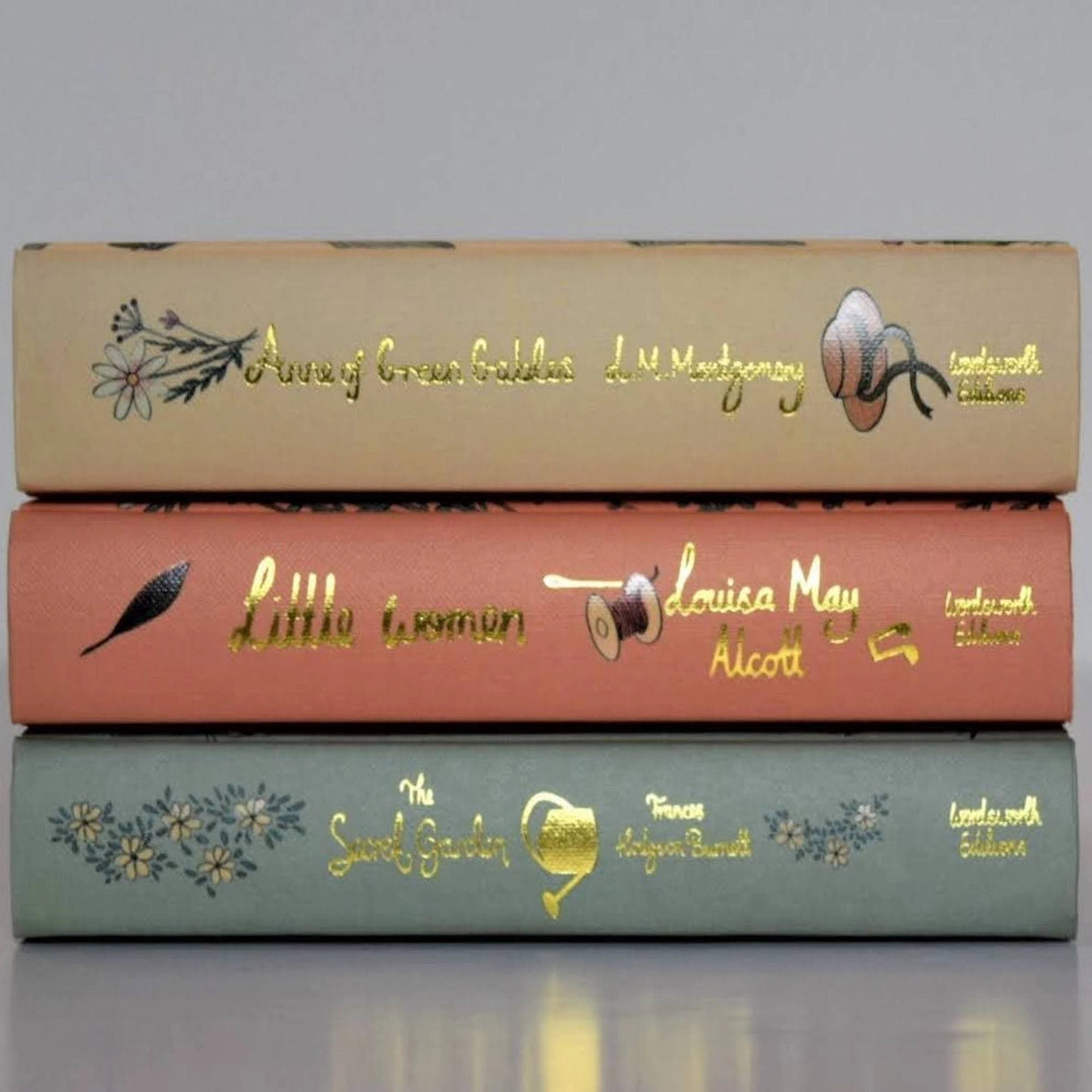 Collector's Edition Hardcover Books Anne of Greem Gables, Little Women, The Secret Garden with decorative covers and gold text.