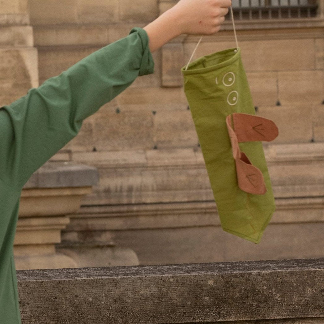 boy holding a babai dragon wind catcher