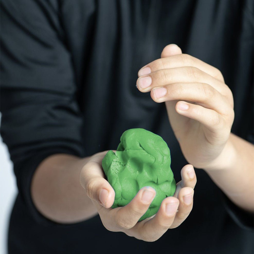 eco-kids boy making his own green dough