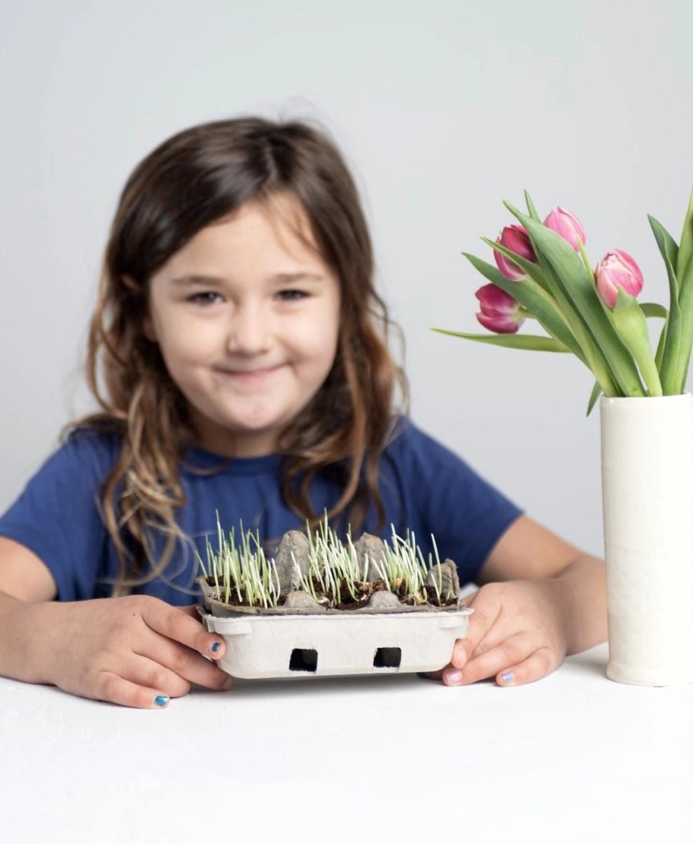 girl with eco kids grass growing kit