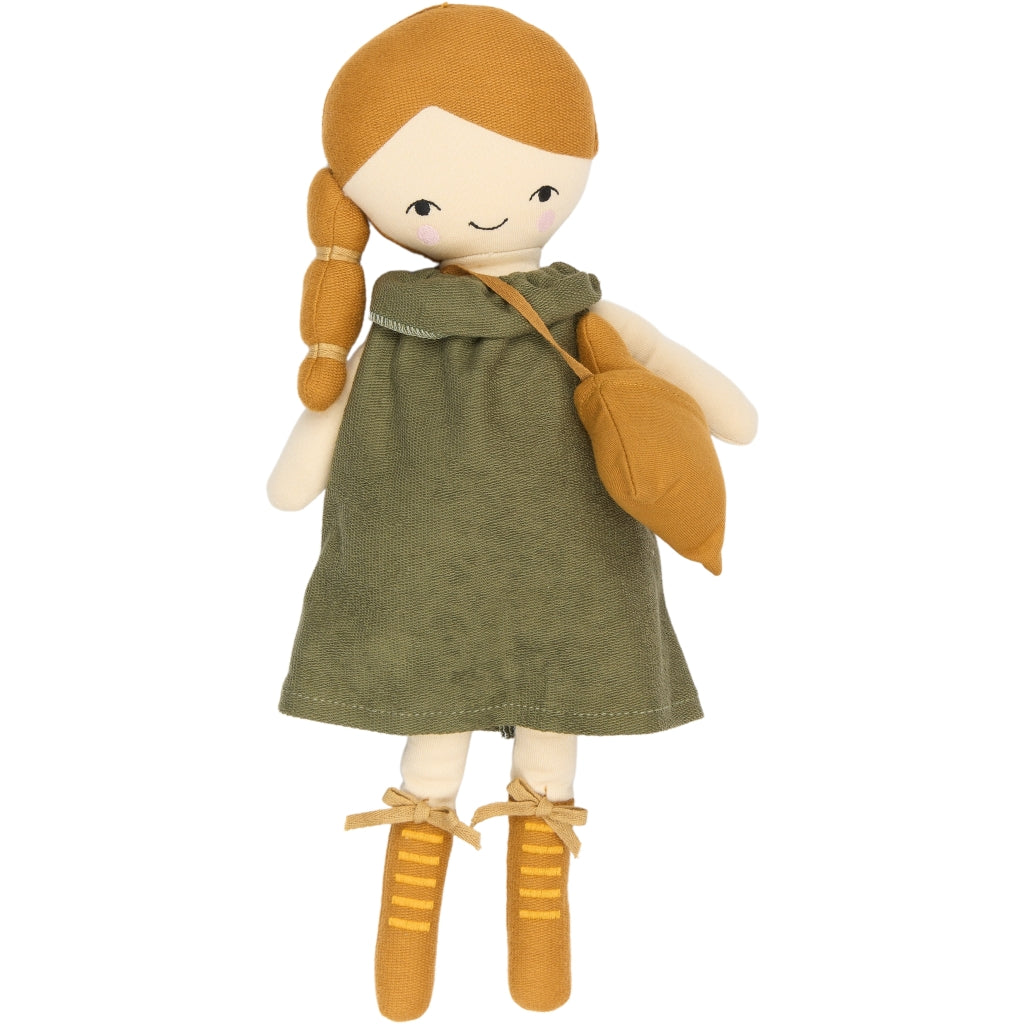 Toy soft acorn doll with green dress and brown shoes on a white background