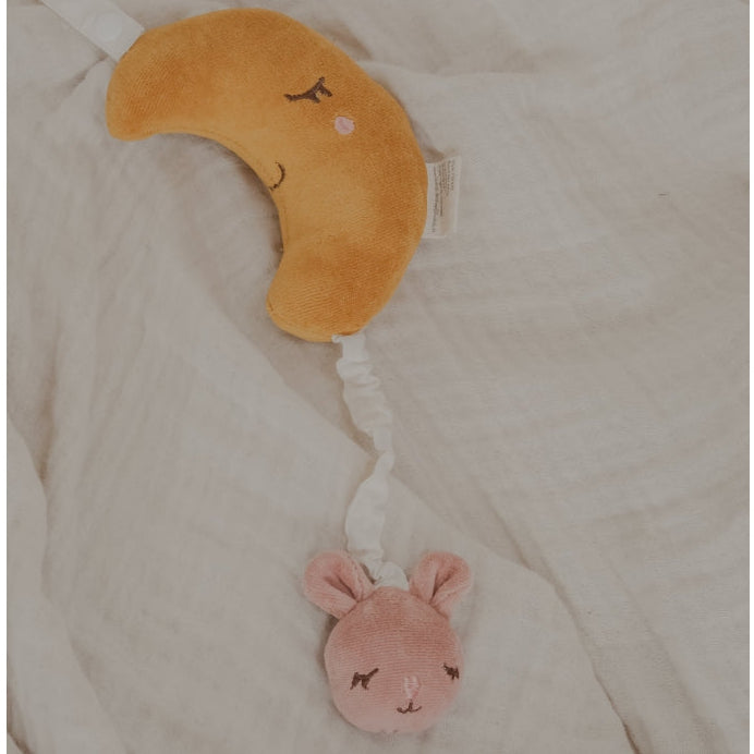 Fabelab organic crescent moon and bunny musical baby mobile on a muslin blanket