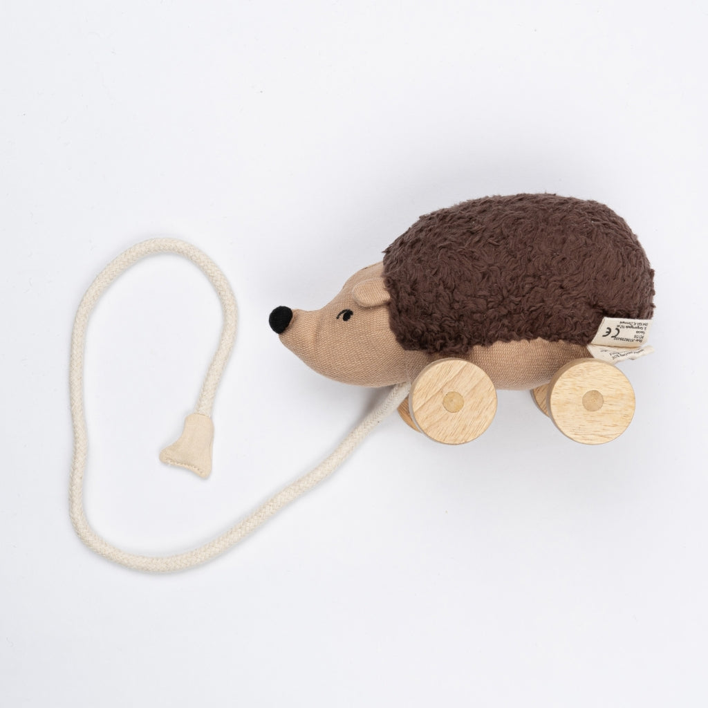 Soft organic Hedgehog pull toy with wooden wheels and a cotton rope
