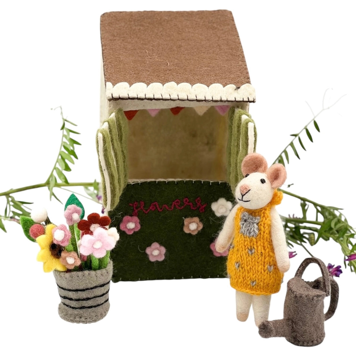 Toy felt play house set with a mouse in a yellow dress next to a flower stand with flowers and a watering can 