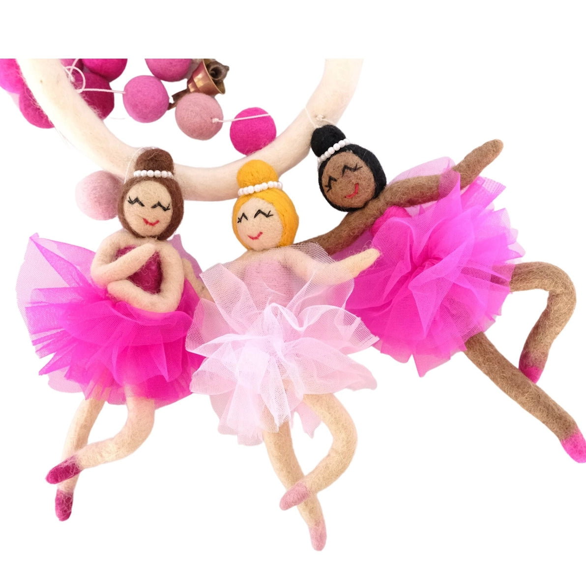 Three felt diverse, multicultural ballerina dolls in tutus 