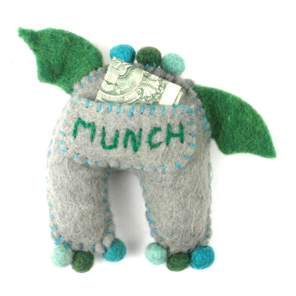Felt gray plush monster tooth fairy pillow with 'MUNCH' embroidered on his pocket