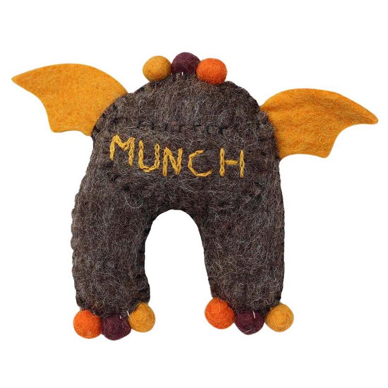Felted monster tooth fairy pillow plush toy with 'MUNCH' embroidered on his back pocket
